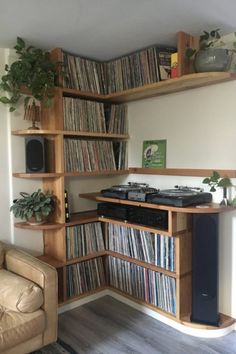 a record player is sitting in front of a shelf full of records