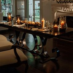 a dining room table with candles on it