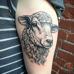 a sheep with curly hair and a hat on it's head is shown in this tattoo