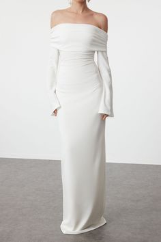 DescriptionThe ALESSIA Off Shoulder Maxi Dress in White is a timeless piece that exudes elegance and sophistication. This stunning gown features a sleek off-shoulder design with long, bell sleeves that add a touch of drama. The figure-hugging silhouette enhances your natural curves, while the floor-length hemline creates a graceful, elongated look. Perfect for formal events, weddings, or special occasions, this dress ensures you make a memorable entrance. Features • Off-shoulder neckline • Long bell sleeves • Figure-hugging silhouette • Floor-length hemline • Invisible zipper at the back • Smooth and stretchy fabric for a comfortable fit • Fully lined Care Instructions • Hand wash cold • Do not bleach • Do not tumble dry • Dry flat in shade • Cool iron on reverse if needed • Do not dry cle White Off The Shoulder Long Sleeve Dress, Elegant White Off-shoulder Dress, Long Sleeve Off The Shoulder Dress, Elegant Off Shoulder Long Sleeve Dress For Evening, Long Sleeve White Dress Formal, Elegant Long Sleeve Off Shoulder Evening Dress, Elegant Long Sleeve Off Shoulder Dress For Formal Occasions, Elegant Long Sleeve Off Shoulder Formal Dress, Chic Off-shoulder Floor-length Wedding Dress