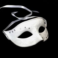 Simplistic for the man in the white rhinestones mask and chic for the woman in the white feather mask. The woman's fabricated texture and lacing veil are destined to pop out at any event. This masquerade mask is great for any occasion. Elegant White Masquerade Mask For Weddings, Elegant White Wedding Masquerade Mask, White Wedding Eye Mask, White Eye Mask For Wedding, White Venetian Masquerade Mask For Wedding, Elegant White Masquerade Mask For Carnival, Elegant White Masquerade Mask For Mardi Gras, Elegant White Eye Mask, White Formal Masquerade Mask For Carnival