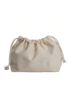 a small white bag with tassels on the front and bottom, sitting on a white background