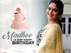 a woman standing in front of a birthday cake