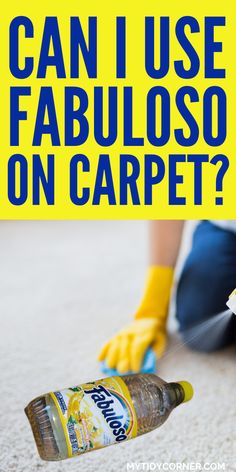 a person in yellow gloves and rubber gloves cleaning carpet with a bottle of fabric on the floor