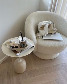 a chair and table with a laptop on it