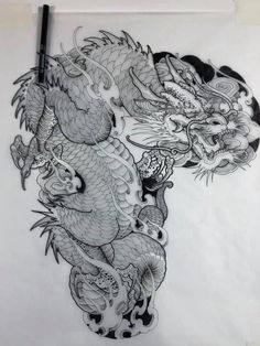 a drawing of two dragon on paper