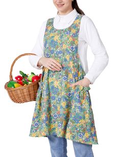 a woman in an apron holding a basket of fruits and vegetables on a white background