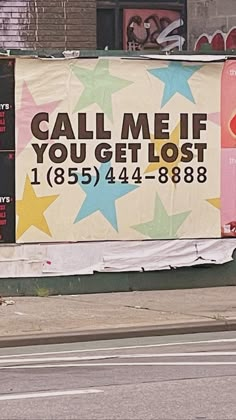 a man riding a skateboard past a large billboard