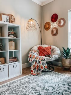 a living room filled with lots of furniture and decor on top of carpeted flooring