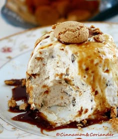 an ice cream sundae on a plate with chocolate sauce