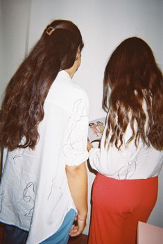 two young women standing next to each other