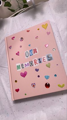 Large pink hardcover scrapbook with newspaper letters reading our memories. Our Scrapbook, School Memory Journal, Memories Album Aesthetic, Memory Dairy Ideas, Scrapbook Mothers Day, Memory Book Aesthetic Ideas, Memories Book Cover Ideas, Mother’s Day Scrapbook, Scrapbook Memory Ideas