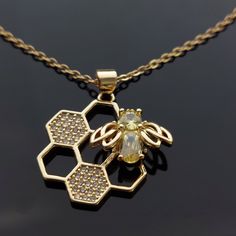 High quality honeycomb bee pendant Honey Bee Jewelry, Honey Jewelry, Honeycomb Necklace, Pretty Jewelry Necklaces, Bee Jewelry, Bee Pendant, Bee Necklace, Jewelry Lookbook