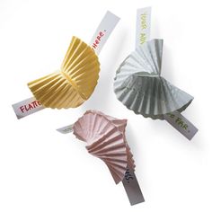 four different types of paper fans on a white surface with the words fair written on them