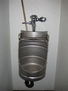 a metal urinal in a bathroom stall