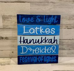 a wooden sign that says love and light, late's hanukkah dreif & festival of lights