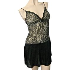 This Is A Very Pretty Black Nightgown From The Oscar De La Renta ’Sugar And Spice’ Collection. It Is A Misses Size X-Small; It Has A Retro ‘Flapper’ Look. The Gown Has A Deep V-Neckline In Front; The Bodice Is A Stretchy Floral Lace With A Nude Silky Lining. The Skirt Is Permanently Pleated All Around And Somewhat See Through. This Is A New Gown With Tags; Msrp Is $64. Nylon/Polyester/Spandex Machine Wash Delicate Black V-neck Sleepwear With Lace Trim, Fitted Black V-neck Nightgown, Black Lace V-neck Sleepwear, Black Flirty Loungewear Sleepwear, Black Fitted V-neck Nightgown, Black Lace Sleepwear For Loungewear, V-neck Lace Sleepwear For Night Out, Flirty V-neck Sleepwear For Night, Flirty V-neck Sleepwear