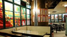 the interior of a chinese restaurant with tables and chairs