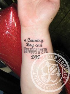 a person's arm with a tattoo on it that says country boy can survive