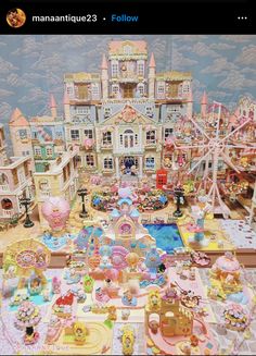 an elaborately decorated doll house with lots of toys