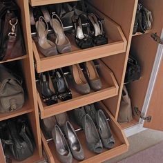 a closet filled with lots of shoes and purses