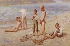 three boys on the beach playing with shoes and other children in the water behind them