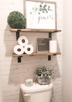 the bathroom is decorated with toilet paper, plants and other things to use for decor