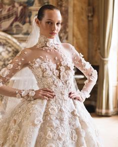 a woman in a wedding dress with flowers on it