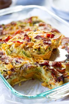 a casserole dish with broccoli and bacon in it is ready to be eaten