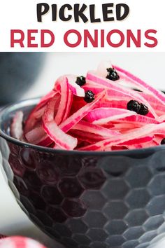 pickled red onions in a black bowl with text overlay that reads pickled red onions