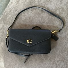 Brand New, Never Worn Coach Cross Body. Perfect Condition. No Box. Coach Wyn Crossbody Bag, Classic Textured Leather Clutch Bag, Coach Textured Leather Rectangular Bags, Coach Textured Leather Evening Bag, Classic Coach Bags In Textured Leather, Classic Coach Bags With Textured Leather, Coach Textured Leather Business Bag, Coach Textured Leather Bag For Formal Occasions, Classic Coach Textured Leather Bag