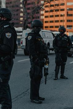 police officers standing in the middle of a street