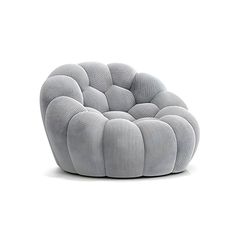 a chair that is made out of fabric and has a circular cushion on the back