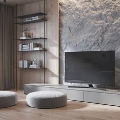 a living room scene with focus on the entertainment center and round ottomans, along with bookshelves