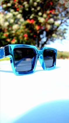 Make a bold statement with our blue metallic finish sunglasses with a square shape frame. 😎🇿🇦. Our shades are the perfect dupe for the louis vuitton millionnaire sunglasses by Virgil Abloh and can add the perfect electric blue pop of colour to your summer ourfit while providing Sun Protection for your eyes with the uv400 lens. South Africans can now enjoy fashionable sunglasses and accessories by shopping online at Izibuko Eywear Summer Ourfits, Fashionable Sunglasses, Square Frame Sunglasses, Virgil Abloh