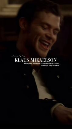 a man laughing while sitting down with his hands in his pockets and the words kla's michaelson above him