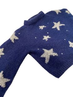 a blue sweater with white stars on it