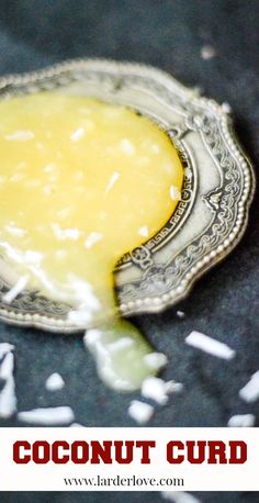 a close up of a spoon with some food on it and the words coconut curd