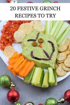 a plate with crackers, celery, carrots and other food on it