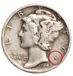 a coin with a red marker on it