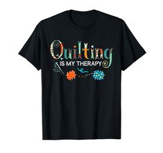 a black t - shirt with the words quilting is my therapy printed on it