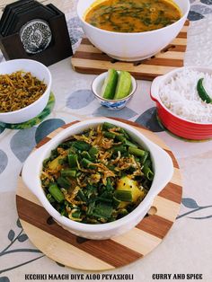 several bowls of food are sitting on a table