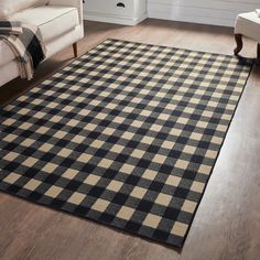 a black and white checkered rug in a living room