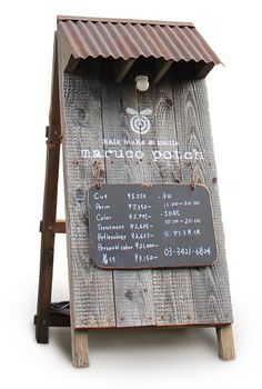 a wooden stand with a sign on it