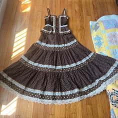 No Flaws. Excellent Condition If Interested In This Item For A Lower Price Please Find Me At Username Frockmevintage On Depop. **** I Have Other Maxi Gunne Sax Sundresses At Home That Are Size 9s And This One Fits Me Looser So I Believe It’s An 11, But There Is No Size Tag, Only The Gunne Tag, So It Could Be A 9. It Is Definitely A 9 Or An 11 Though, Not A 7, Not A 13. Please Reach Out With Any Questions On Sizing. Measurements: Pit To Pit Between 15 & 15.5 Inches Flat, This Does Not Account For The Cupping At The Bust Which Does Give More Room, And Then There Is Some Flexibility With The Corset Waist At Point Of Peplum: 13.5 Inch Flat, This Measurement Is Definitely More Straightf Fitted Cotton Tiered Midi Dress, Fitted Tiered Cotton Midi Dress, Fitted Brown Tiered Dress, Fitted Tiered Brown Dress, Vintage Brown Lined Dress, Fitted Brown Midi Dress For Garden Party, Fitted Tiered Dress With Lace Trim, Fitted Vintage Brown Maxi Dress, Vintage Brown Midi Length Dress