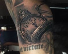 an image of a man with tattoos on his arm that has a pocket watch tattoo on it