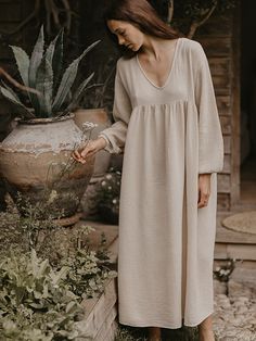 One of our personal favorites, this is truly the most perfect and flattering style for all shapes and sizes. Featuring a deep V-neck, empire waist, billowing sleeves, and a full-flowing skirt, The Meadow Dress is breezy and effortless, just like a wildflower meadow. We adore how it looks with The Woven Mule. For reference, Rossella in our first featured image is 5’3 and is wearing The Meadow Dress in size S (US 4-6). It’s designed to be worn loose and flowy, so we recommend sizing down if you pr Fae Dress, Meadow Dress, The Simple Folk, Clothes Drawing, Loose Clothes, Muslin Dress, Earth Mama, Wildflower Meadow, Butterfly Fairy