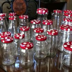 red and white polka dot glass bottles lined up on a table