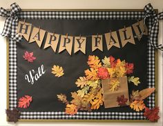 a happy fall bulletin board decorated with leaves