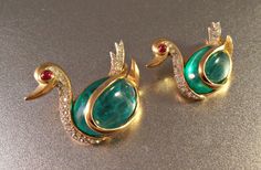 A stunning vintage pair of Trifari Flawed Emerald Gripoix Glass Jelly Belly Rhinestone Swan brooch pins are offered for your consideration. An Swan Brooch, India Design, Amethyst Studs, Trifari Jewelry, Gold Pendant Jewelry, Gold Jewelry Earrings, Jelly Belly, Baby Jewelry, Gold Ornaments